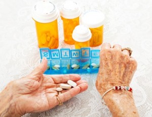 Elderly Hands Sorting Pills