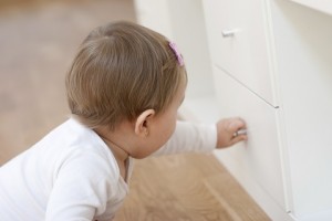 Baby opening a drawer