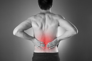 Kidney pain. Man with backache. Pain in the man's body